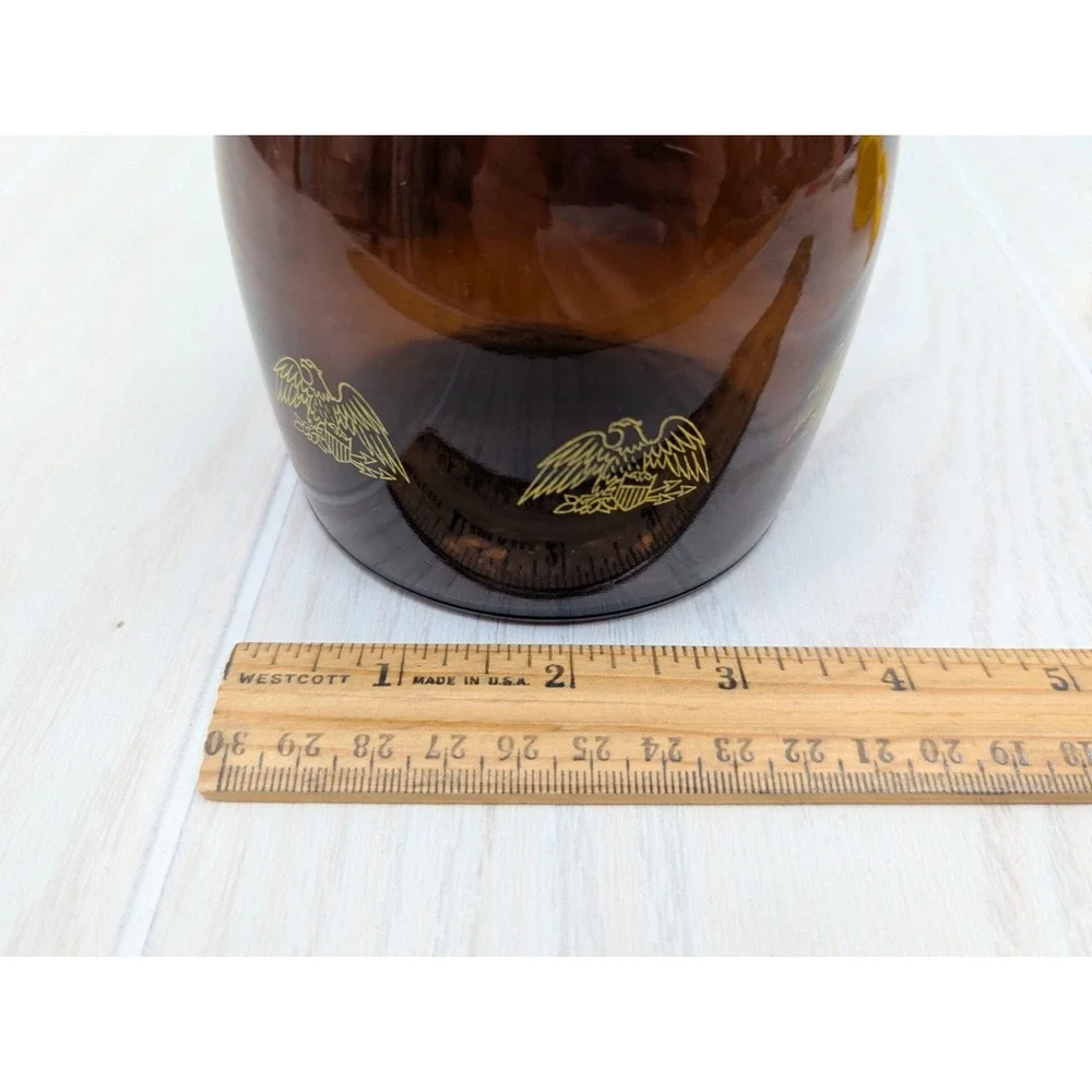 Log Cabin vintage syrup dispenser pitcher amber glass yellow lid patriotic eagle